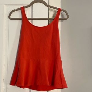 Melon peplum tank top